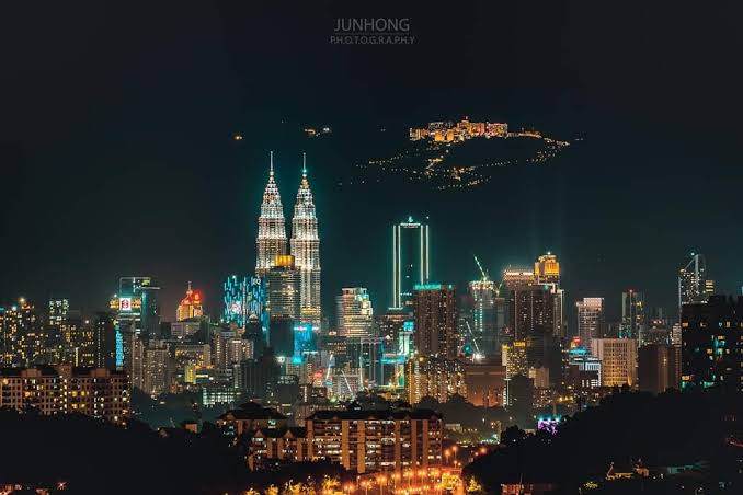 Petronas Twin Towers and Batu Caves Murugan Statue in Malaysia
